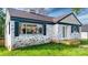 This brick home has beautiful windows, dark shutters, and a small front porch at 112 Circle Dr, Salisbury, NC 28144