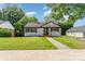 Charming brick home featuring a walkway and well-manicured lawn at 112 Circle Dr, Salisbury, NC 28144
