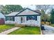 Cozy home with a brick facade, quaint front porch and manicured green lawn at 112 Circle Dr, Salisbury, NC 28144