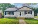 Charming brick home featuring shuttered windows, a quaint front porch and manicured front lawn at 112 Circle Dr, Salisbury, NC 28144