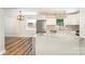Bright kitchen featuring an island with granite countertops, stainless steel appliances and hardwood floors at 112 Circle Dr, Salisbury, NC 28144