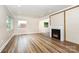 Spacious living room with hardwood floors, natural light, and a cozy fireplace at 112 Circle Dr, Salisbury, NC 28144