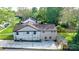 Aerial view of home showcasing a large backyard, patio, and ample parking space at 112 Circle Dr, Salisbury, NC 28144