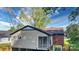 The rear exterior shows a screened porch, and the home's brick and siding construction at 112 Circle Dr, Salisbury, NC 28144