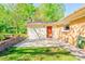 Outdoor patio with a brick wall, flower boxes, and a cozy outdoor space for relaxation and entertaining at 113 Princess Ln, Dallas, NC 28034
