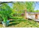 Lush backyard featuring a well-maintained lawn, landscaping, and the home's exterior offers a private oasis at 113 Princess Ln, Dallas, NC 28034