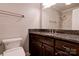 Bathroom with granite vanity, framed mirror, and a shower with glass enclosure and marble-look tile at 113 Princess Ln, Dallas, NC 28034
