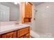 Updated bathroom featuring a white quartz vanity, updated shower with white subway tile, and modern fixtures at 113 Princess Ln, Dallas, NC 28034