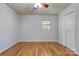 Bedroom featuring hardwood floors, neutral walls, one window, closet, and ceiling fan at 113 Princess Ln, Dallas, NC 28034
