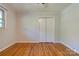 Bedroom featuring hardwood floors, neutral walls, and a closet at 113 Princess Ln, Dallas, NC 28034