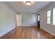 Spacious bedroom with hardwood floors, natural light, and white painted doors at 113 Princess Ln, Dallas, NC 28034
