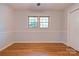 Relaxing bedroom with hardwood floors, neutral walls, and a double window providing ample natural light at 113 Princess Ln, Dallas, NC 28034