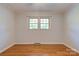 Bedroom featuring hardwood floors, neutral walls, and one window at 113 Princess Ln, Dallas, NC 28034