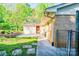 View of the house exterior, showcasing the brick and siding details and landscaped walkway at 113 Princess Ln, Dallas, NC 28034