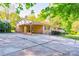 Charming brick home with a covered carport, well-maintained landscaping, and a welcoming front entrance at 113 Princess Ln, Dallas, NC 28034