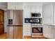 Updated kitchen with stainless steel appliances, a modern range and refrigerator at 113 Princess Ln, Dallas, NC 28034