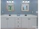 Bathroom with a double sink vanity, modern mirrors and fixtures, and lots of cabinet space at 1202 Foxfield Rd, Waxhaw, NC 28173