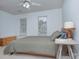 Bedroom with neutral carpet, side table with lamp, and two windows providing lots of natural light at 1202 Foxfield Rd, Waxhaw, NC 28173