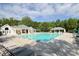 Large community pool with ample seating and shaded areas, perfect for summer relaxation at 1202 Foxfield Rd, Waxhaw, NC 28173