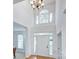 Bright entryway with hardwood floors, chandelier, and large transom window at 1202 Foxfield Rd, Waxhaw, NC 28173