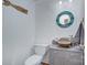 Charming half bathroom with stylish vanity, toilet, and coastal decor at 1202 Foxfield Rd, Waxhaw, NC 28173