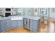 Charming eat-in kitchen features a farmhouse sink, granite counters and stainless steel appliances at 1202 Foxfield Rd, Waxhaw, NC 28173