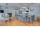 Bright kitchen with granite countertops, stainless steel appliances, an island bar and an eat-in breakfast nook at 1202 Foxfield Rd, Waxhaw, NC 28173
