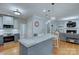 Bright kitchen with granite countertops, stainless steel appliances, and an open floor plan at 1202 Foxfield Rd, Waxhaw, NC 28173