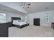 Spacious main bedroom with large windows and vaulted ceilings providing natural light at 1202 Foxfield Rd, Waxhaw, NC 28173