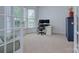 Bright office space with a desk, chair, and an abundance of natural light from bay windows at 1202 Foxfield Rd, Waxhaw, NC 28173