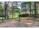 Swingset playground surrounded by mature trees at 1202 Foxfield Rd, Waxhaw, NC 28173