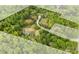 Expansive wooded acreage outlined, revealing a serene homesite with winding drive and natural beauty at 124 Neumann Run, Belmont, NC 28012