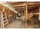 Rustic barn interior with wooden beams, stalls and ladder at 124 Neumann Run, Belmont, NC 28012