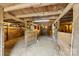 Interior view of a rustic horse barn with wooden stalls, offering a glimpse into equestrian life at 124 Neumann Run, Belmont, NC 28012