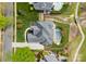 Aerial view of a home showcasing a swimming pool, well-manicured lawn, and a long driveway at 13420 Robert Walker Dr, Davidson, NC 28036