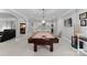 Basement with a billiard table, mini-bar, and neutral carpeting; great for entertaining Gathering and friends at 13420 Robert Walker Dr, Davidson, NC 28036