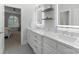 Modern bathroom features dual sinks, marble countertops, and well-lit mirrors for a spa-like experience at 13420 Robert Walker Dr, Davidson, NC 28036