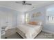 Comfortable bedroom featuring soft blue walls, double closets, and natural light at 13420 Robert Walker Dr, Davidson, NC 28036