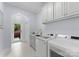 Functional laundry room with new washer and dryer units and a convenient sink at 13420 Robert Walker Dr, Davidson, NC 28036