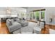 Open-concept living room with backyard access, a fireplace, and a modern kitchen at 13420 Robert Walker Dr, Davidson, NC 28036