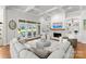 Inviting living room featuring a fireplace, coffered ceiling and backyard access at 13420 Robert Walker Dr, Davidson, NC 28036