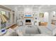 Cozy living room with a fireplace, built-in shelves, and neutral-toned furniture at 13420 Robert Walker Dr, Davidson, NC 28036