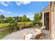 Outdoor patio with comfortable lounge chairs that overlook the golf course for outdoor entertaining at 13420 Robert Walker Dr, Davidson, NC 28036
