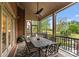 Covered patio perfect for outdoor dining overlooking the golf course and featuring a ceiling fan at 13420 Robert Walker Dr, Davidson, NC 28036