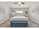 Comfortable bedroom with neutral decor, a bed, and a decorative tree at 15 Willow Oaks Ct, Taylorsville, NC 28681