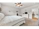 Bright bedroom with ceiling fan, carpet flooring, and a doorway leading to another room at 15 Willow Oaks Ct, Taylorsville, NC 28681