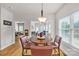 Dining area with modern lighting fixture and view of the sunroom and office at 15 Willow Oaks Ct, Taylorsville, NC 28681