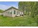 Charming home featuring a quaint patio area for outdoor relaxation and picturesque lawn at 15 Willow Oaks Ct, Taylorsville, NC 28681