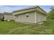 Side exterior shot of the building, showing a well-manicured lawn and convenient side entrance at 15 Willow Oaks Ct, Taylorsville, NC 28681