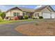 Charming home featuring manicured lawn, beautiful landscaping, and inviting front porch at 15 Willow Oaks Ct, Taylorsville, NC 28681
